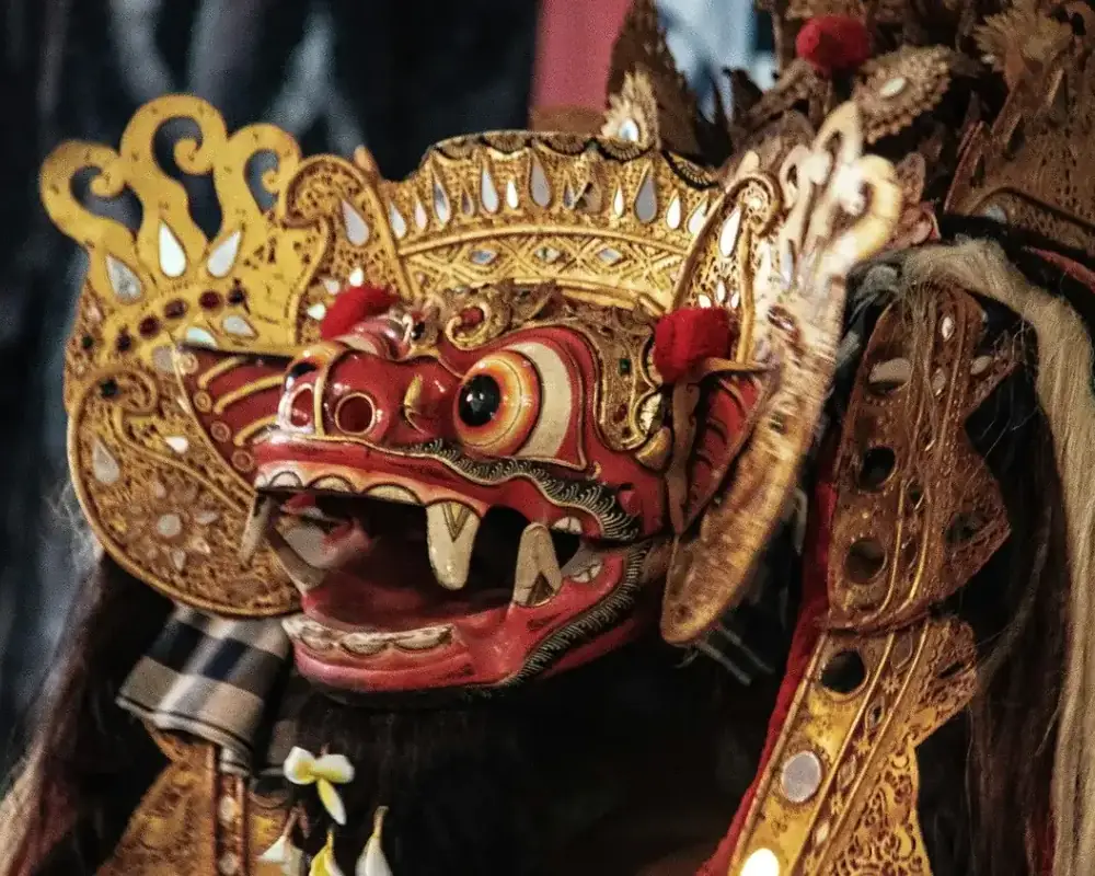Close-up of a gilded red Barong mask