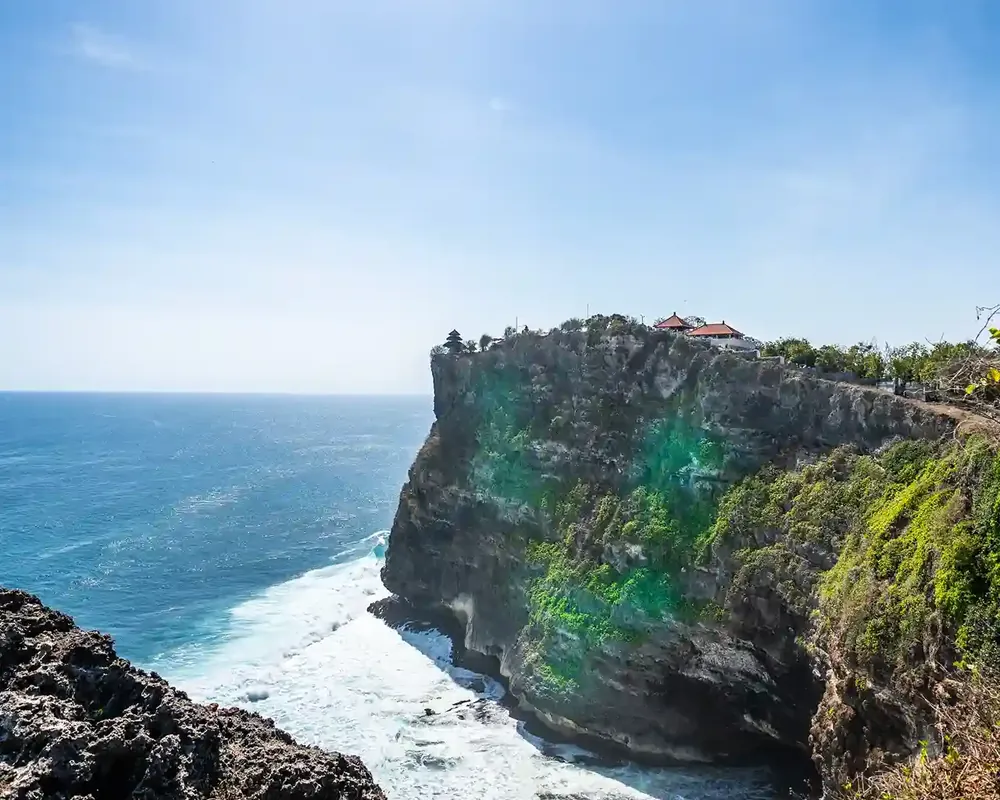 A sea cliff at Uluwatu above breaking waves