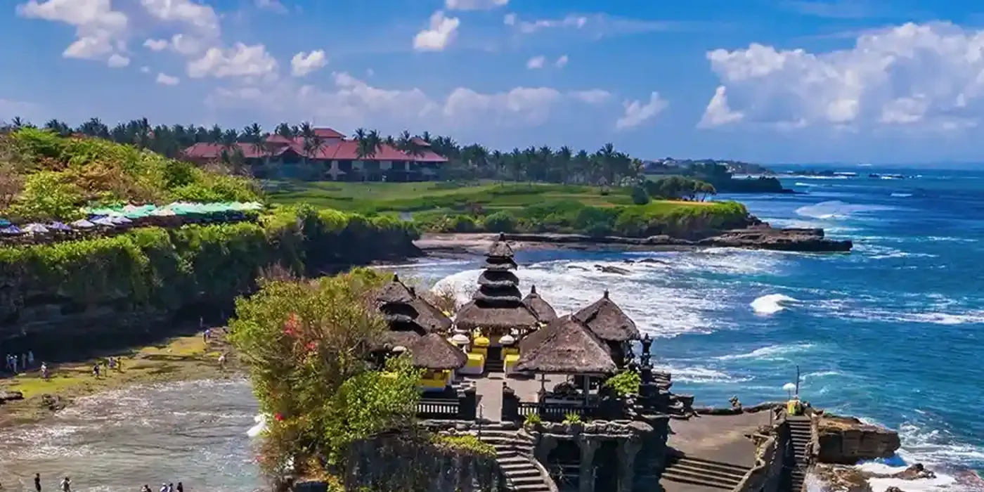 Tanah Lot temple on a rock above the surf, seen from the air