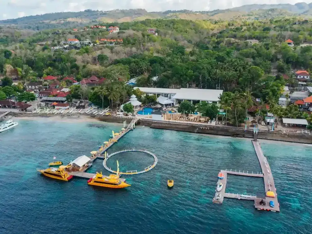 Aerial view of a Nusa Penida bay with boats at the jetty