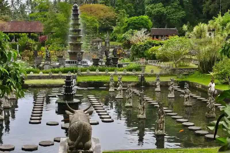 Stepping stones and a tiered fountain at the Tirta Gangga water palace